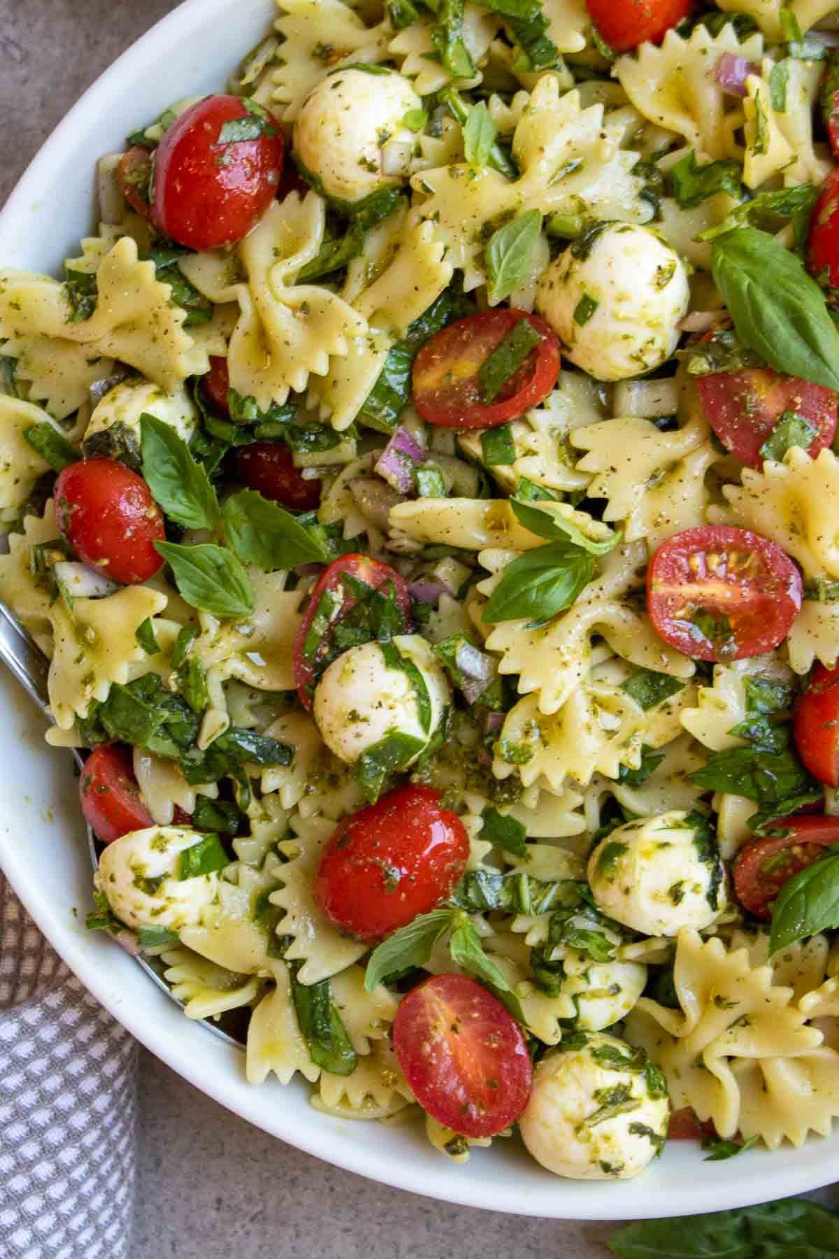 Italian Bow Tie Pasta Salad with Pesto, Bocconcini, and Cherry Tomatoes