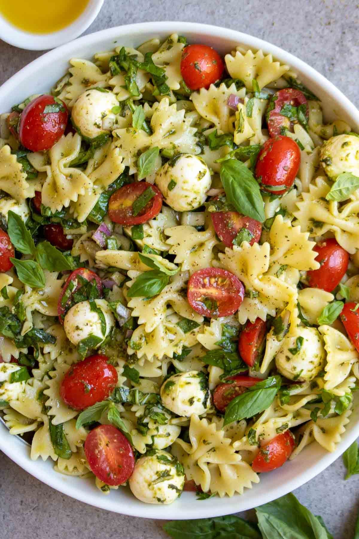 Italian Bow Tie Pasta Salad with Pesto, Bocconcini, and Cherry Tomatoes